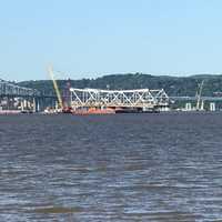 <p>Work on dismantling the old Tappan Zee Bridge continues adjacent to the new bridge.</p>