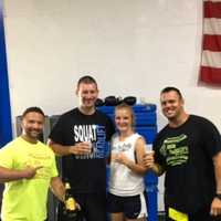 <p>One Fitness owners Angelo Mazza (far left) and Rob DeBrino (far right) with the happy couple</p>