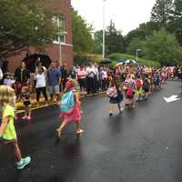 <p>Parents cheer and take photos to capture the first day of school at Darien&#x27;s Royle School.</p>