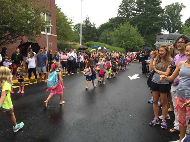 Parents cheer and take photos to capture the first day of school at Darien&#x27;s Royle School.