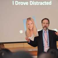 <p>Joe Feldman, founder of End Distracted Driving, hold a picture of his daughter, Casey, who was killed by a distracted driver.</p>