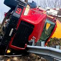 <p>A driver escaped serious injury after his cement truck rolled onto a divider on Route 208 in Fair Lawn Thursday morning, April 4.
  
</p>