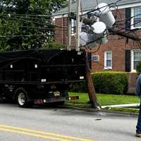 <p>Utility worker sizes up the situation after the mishap on East Ridgewood Avenue in Ridgewood around 10 a.m. Monday, July 24.</p>