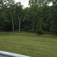 <p>Norwalk police SUV is in the woods behind Roton Middle School as the search continues Friday for an elderly man who attacked a teenage girl.</p>