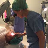 <p>Dr. Stephanie Becker checks on a patient in Honduras.</p>