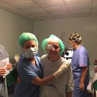 <p>Dr. Stephanie Becker assists a patient after she had surgery.</p>