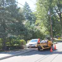 <p>A paving vehicle is parked not far from Phelps Avenue. </p>