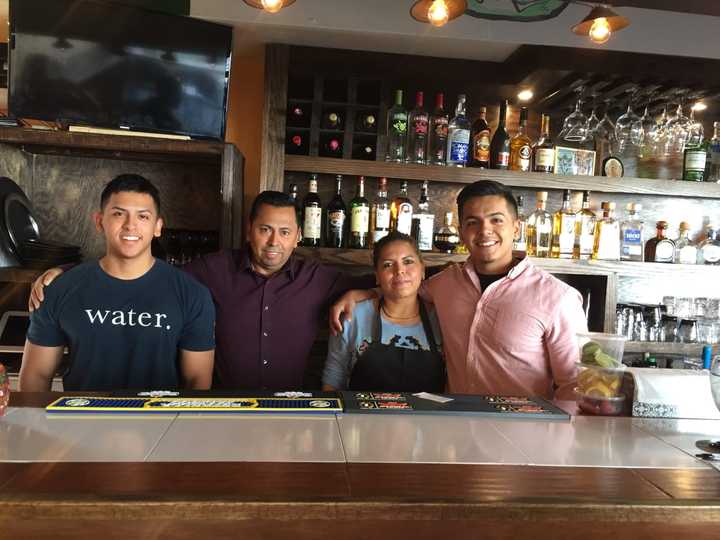 La Casita owner Guillermo Jimenez with his wife and twin boys, Christopher and Uriel, 20.