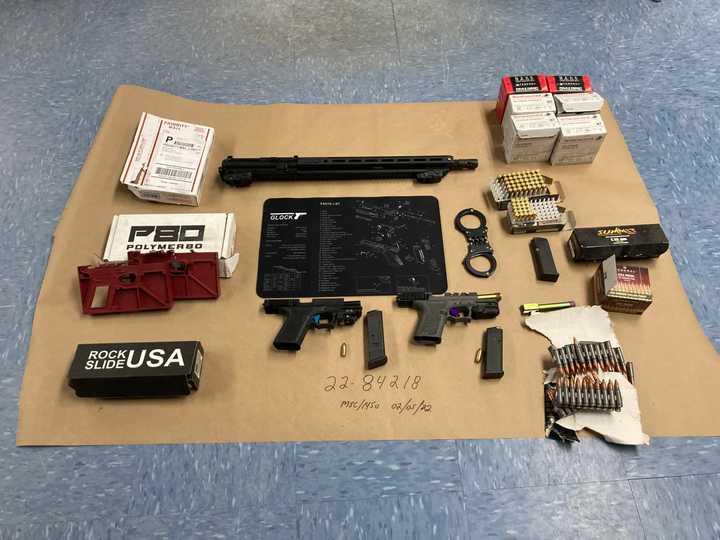 A 34-year-old Long Island man was charged after police said a search warrant uncovered multiple loaded &quot;ghost guns&quot; in his home.