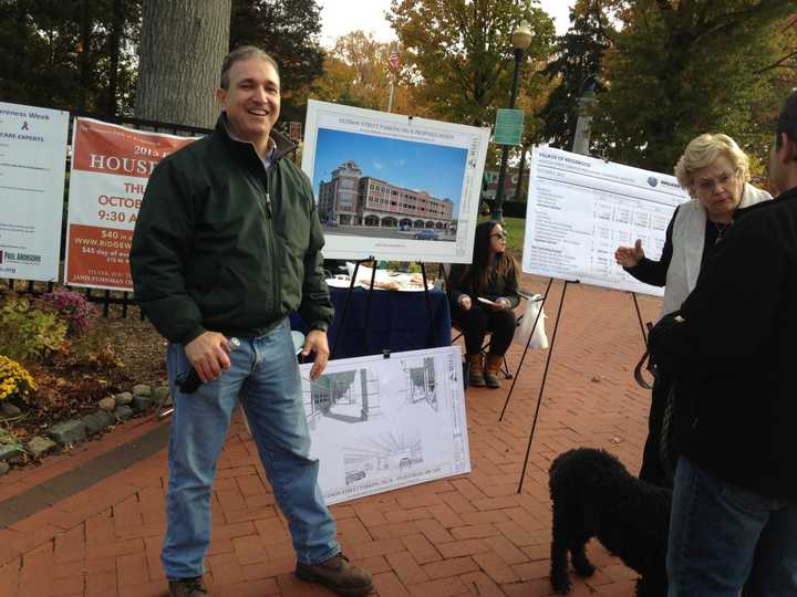 Mayor Paul Aronsohn and Village Manager Roberta Sonenfeld brief guests on Ridgewood&#x27;s proposed parking garage during Halloween festivities on Oct. 31.