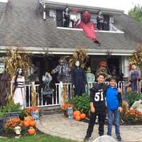 <p>Kyle, left, and Aiden Campenlli outside of their Upper Saddle River home.</p>