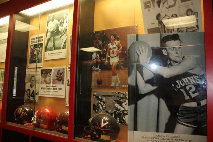 The late Gerry Calabrese (r.), his son, Tom (center) and others are in the Cliffside Park Hall Of Fame display at CPHS. 