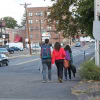 <p>Students leaving class walk along East Clinton Avenue near Bergenfield High School. </p>