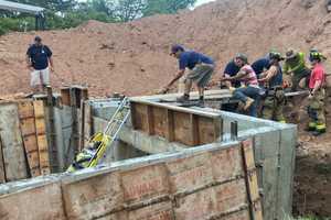 PHOTOS: Firefighters, Colleagues Rescue Fallen Construction Worker