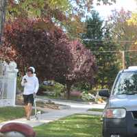 <p>A pedestrian walks  alongHillside Avenue, one of the new one-way roadways in the borough. </p>