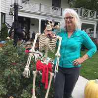 <p>Ellyn Ward and one of her many Halloween decorations.</p>