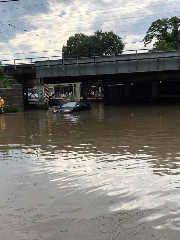 Motorists Trapped In Flooded Waters Rescued By Firefighters