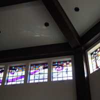 <p>Colorful windows replace the once plain glass in the daily chapel at Closter's Emanu-el Temple. </p>