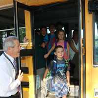 <p>Lakeland Central School District students get ready to get off the bus on the first day of classes.</p>