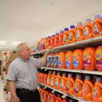 <p>John Encke of Stop &amp; Shop shows the comparison price tags in the new Closter shop. </p>