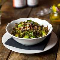 <p>At Peaches&#x27; in Norwalk, Brussel sprouts come crispy in a ginger rum glaze with cotija cheese and pepitas.</p>