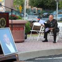 <p>Paterson Mayor Jose Torres reviews his remarks before the beginning of the city's 9/11 memorial ceremony. </p>