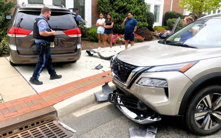 The Toyota minivan got knocked onto the sidewalk and nearly slammed into an office building on East Ridgewood Avenue at the corner of North Maple Avenue in Ridgewood shortly before 11:30 a.m. Thursday, Aug. 24.