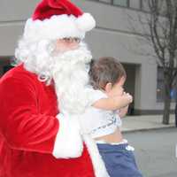 <p>He didn&#x27;t have any snowballs to throw, but Santa did hug a few children.</p>