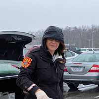 <p>Suffolk County Police Commissioner Geraldine Hart drops off coffee.</p>