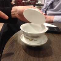 <p>Shu-Chuan Chen points out the components of a traditional Taiwanese tea cup, gaiwan, which refers to the lid used to keep tea leaves out of the drinker&#x27;s mouth when sipping tea. The gaiwan can be used for both brewing and drinking tea.</p>