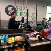 <p>Traditional shoppers pay with a cashier</p>