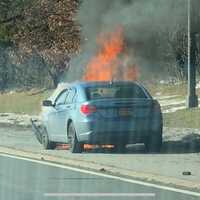 <p>A second vehicle on fire.</p>