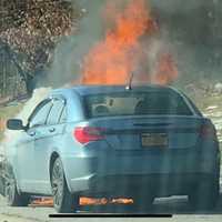 <p>Traffic was slowed on the Southern State Parkway as a car fire burned.</p>