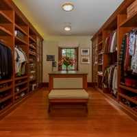 <p>The Abramenko&#x27;s mansion has a walk-in closet with a telephone, television and sofa.</p>