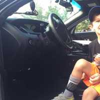 <p>Ethan, 5, gets to see the inside of a Paramus police car.</p>