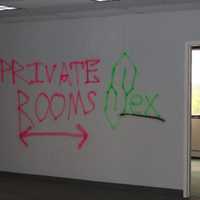 <p>Police found spray-painted signs at the illegal pop-up party in a vacant commercial building off Route 23 in Wayne.</p>