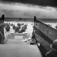 <p>D-DAY: Men of the 16th Infantry Regiment, US 1st Infantry Division wading ashore on Omaha Beach on the morning of June 6, 1944</p>