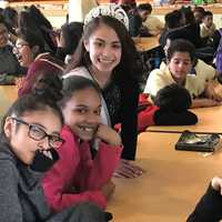 <p>Isabella Galan, wearing a crown, spearheaded an effort to collect and donate more than 2,000 books to Paterson schools.</p>