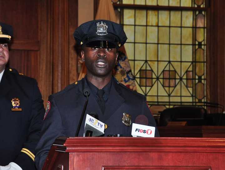 Officer Morton Otundo at his December 2013 police academy graduation, where he served as the Class President.