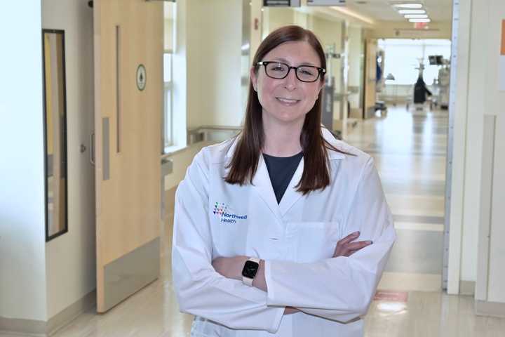 Alexis L. Grucela, MD, the new director of Northern Westchester Hospital’s Institute for Robotic and Minimally Invasive Surgery, stands outside the hospital’s six state-of-the-art operating rooms fitted with four da Vinci® XI Robotic Surgical Systems