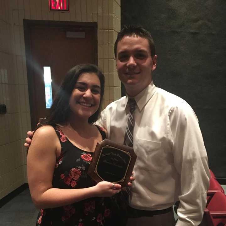 Briarcliff High School student Jillian Agona. left, won first place at a speech competition at Suffern High School on Dec. 10 in the dramatic monologue category. She is pictured here with debate team adviser Daniel Lavelle.