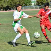 <p>Joe Moon fighting for possession</p>