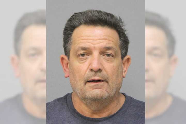 John Courtien, age 57, was arrested after he allegedly set fire to a Rockville Centre house and two cars, police said.&nbsp;