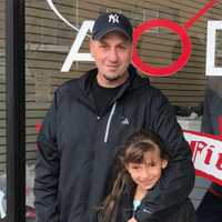 <p>Hasbrouck Heights coach John Valenti and his daughter Gianna say good bye to Overdrive Training in Wood-Ridge.</p>