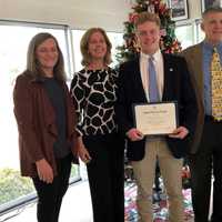 <p>John Lochtefeld receives the award from Darien&#x27;s Good Wife&#x27;s River Chapter DAR Good Citizen Chairperson Kim Kiner as his parents, Nancy and father Tom, and DAR Good Good Wife&#x27;s River Chapter Regent, Katherine Love look on.</p>