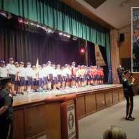 <p>The 22nd East Rutherford Junior Police Academy graduates. INSET: Retiring Police Chief Larry Minda</p>