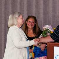 <p>Judy Jensen is congratulated for 50 years of service at Cartus by Dan Fisher, director of operations accounting, and Anat Schneider, manager of Client Finance, Corp F&amp;A, on her big day.</p>