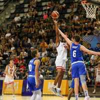 <p>Justin Price playing basketball at the Maccabiah Games</p>