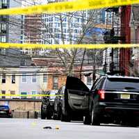 <p>Detectives placed no fewer than 18 yellow evidence markers where cartridge casings, blood spatter and bullet holes were found.
  
</p>