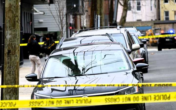 Investigators at the scene of the March 9 homicide on Jordan Avenue off Mercer Street near McGinley Square in Jersey City.